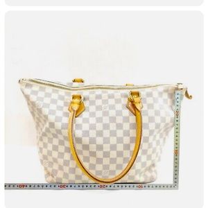 Louis Vuitton Saleya MM Preowned and looks great!  The size & style is timeless.